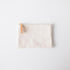 Handmade heavyweight cotton canvas zip pouch with a solid brass zipper and tan leather pull for easy organization.