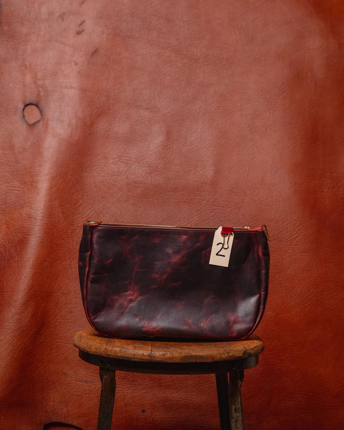 2.  Violet Rustic Bison Crossbody Bag (scratched)