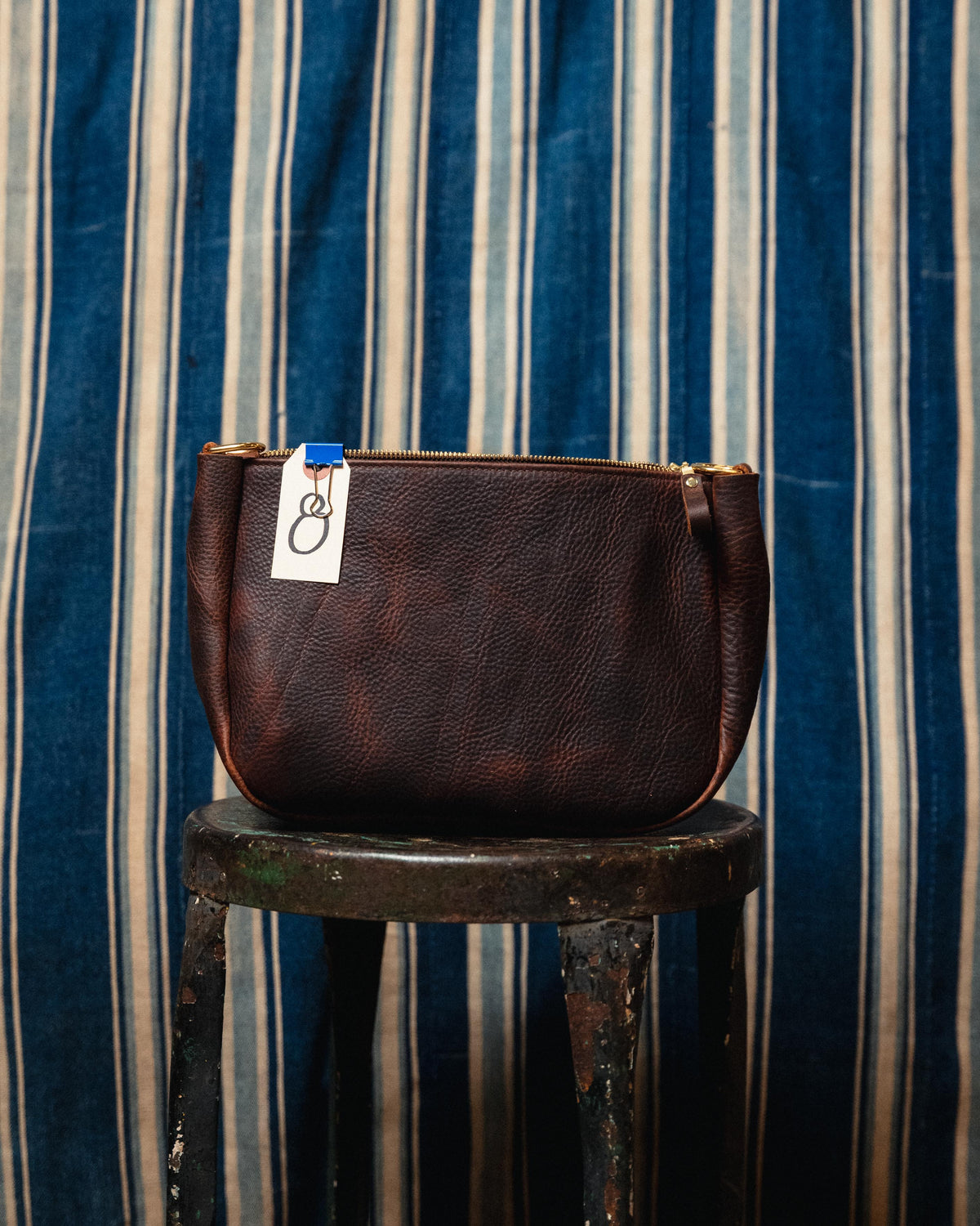8. Brown Kodiak Medium Crossbody Bag