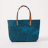 Handmade Petrol Blue Bison leather East West tote bag featuring a rich pebbled grain texture and durable tan leather handles.