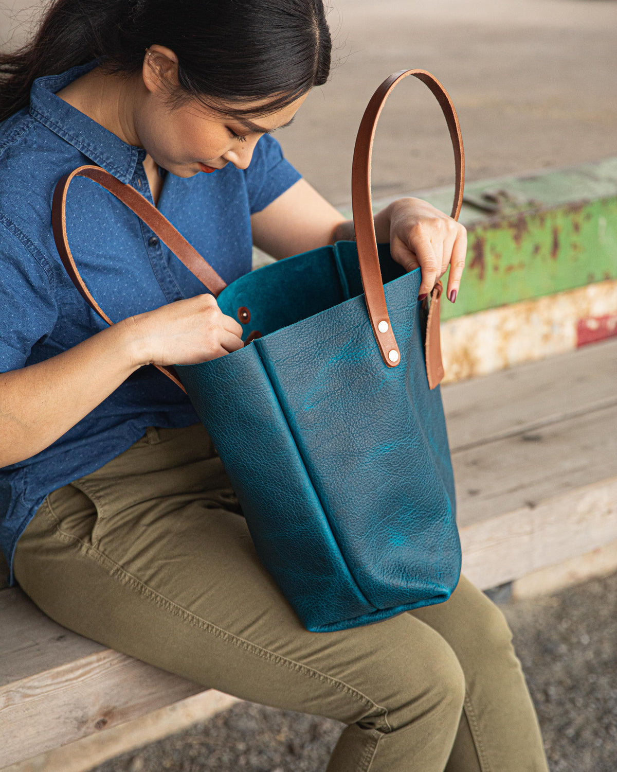 Handmade Petrol Blue Bison leather tote bag featuring a rich, natural grain and durable tan leather shoulder straps.