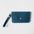 Petrol Blue Bison Wristlet Clutch: full-grain leather, 8.5x5.25 inches, with a 5.5-inch strap and brass snap.